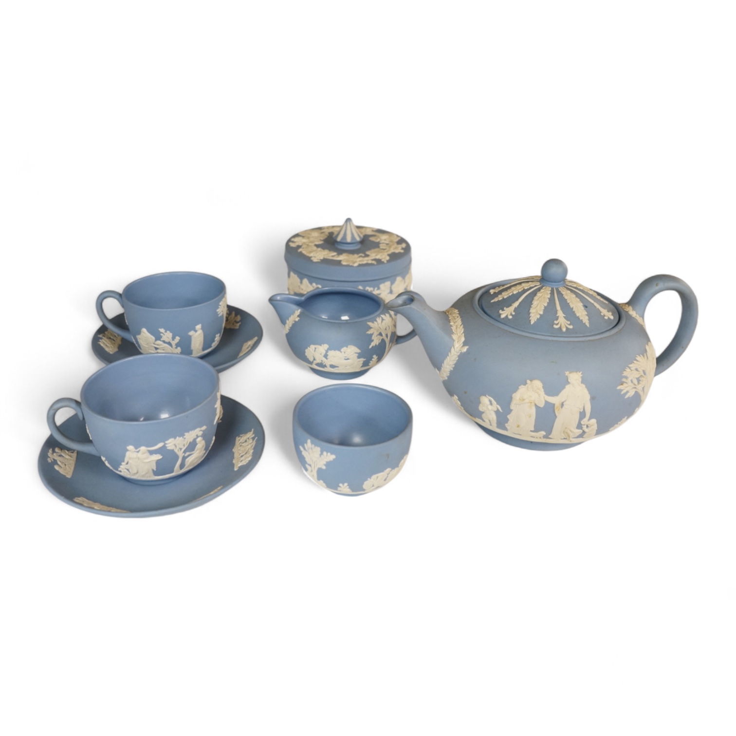 A Wedgwood blue jasperware eight-piece tea set, largest 22cm high